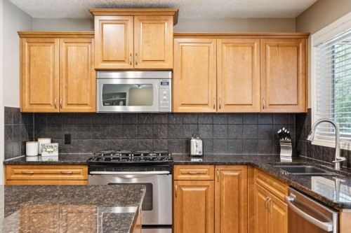 51 Sienna Park Crescent Sw, Calgary, AB - Indoor Photo Showing Kitchen With Double Sink With Upgraded Kitchen