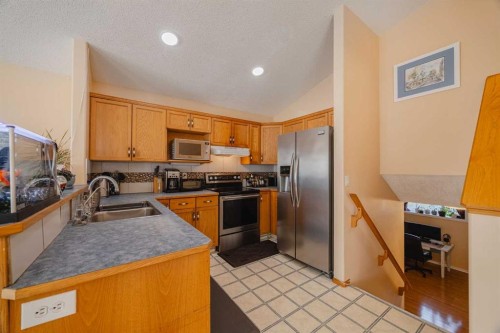 23 Tarington Way Ne, Calgary, AB - Indoor Photo Showing Kitchen With Double Sink