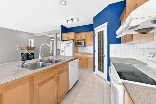 16 Royal Birch Rise Nw, Calgary, AB - Indoor Photo Showing Kitchen With Double Sink