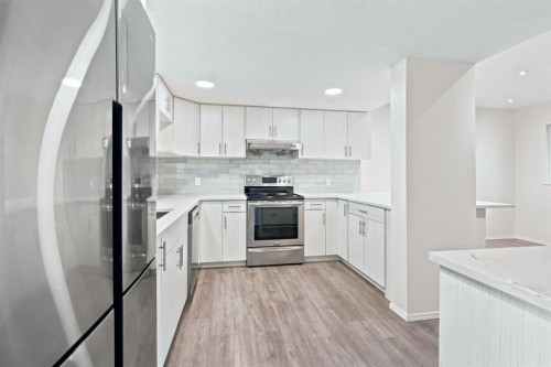 84-5810 Patina Drive Sw, Calgary, AB - Indoor Photo Showing Kitchen With Upgraded Kitchen