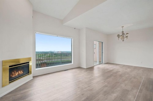 84-5810 Patina Drive Sw, Calgary, AB - Indoor Photo Showing Living Room With Fireplace