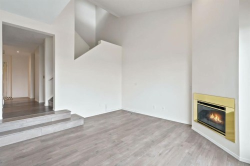 84-5810 Patina Drive Sw, Calgary, AB - Indoor With Fireplace