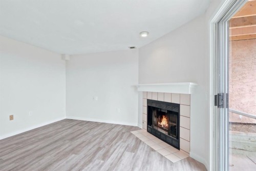 84-5810 Patina Drive Sw, Calgary, AB - Indoor With Fireplace