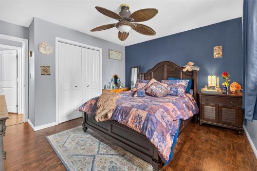 121 Edey Close, Cremona, AB - Indoor Photo Showing Bedroom