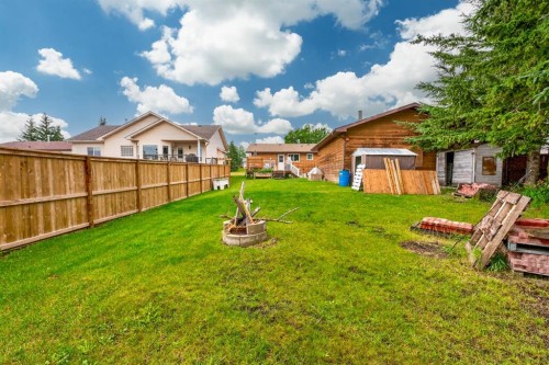 121 Edey Close, Cremona, AB - Outdoor With Backyard