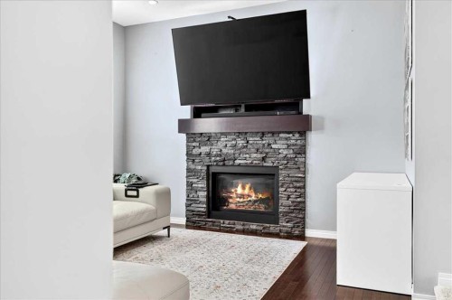 60 Mahogany Grove Se, Calgary, AB - Indoor Photo Showing Living Room With Fireplace
