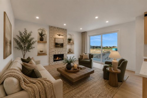 111 North Bridges Garden, Langdon, AB - Indoor Photo Showing Living Room With Fireplace