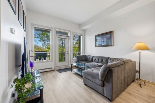 107-3101 34 Avenue Nw, Calgary, AB - Indoor Photo Showing Living Room