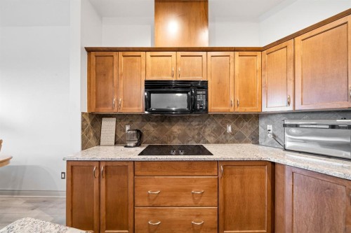 107-3101 34 Avenue Nw, Calgary, AB - Indoor Photo Showing Kitchen