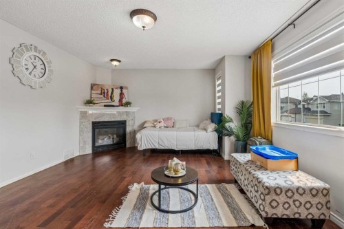 181 Tuscarora Place Nw, Calgary, AB - Indoor Photo Showing Other Room With Fireplace