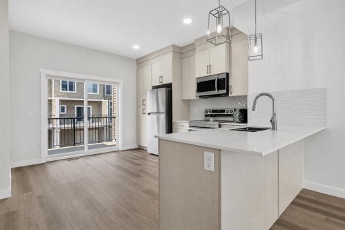 207-75 Cornerstone Row Ne, Calgary, AB - Indoor Photo Showing Kitchen With Double Sink With Upgraded Kitchen