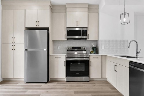 207-75 Cornerstone Row Ne, Calgary, AB - Indoor Photo Showing Kitchen With Stainless Steel Kitchen With Upgraded Kitchen
