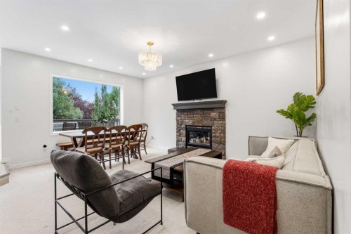 50 Somerglen Park Sw, Calgary, AB - Indoor Photo Showing Living Room With Fireplace