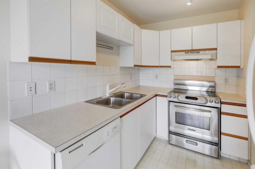 57 Sandpiper Lane Nw, Calgary, AB - Indoor Photo Showing Kitchen With Double Sink
