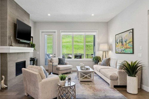 176 Cranbrook Drive Se, Calgary, AB - Indoor Photo Showing Living Room With Fireplace