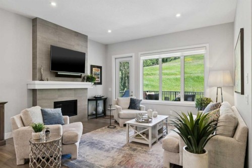 176 Cranbrook Drive Se, Calgary, AB - Indoor Photo Showing Living Room With Fireplace