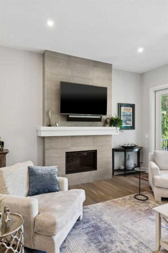 176 Cranbrook Drive Se, Calgary, AB - Indoor Photo Showing Living Room With Fireplace