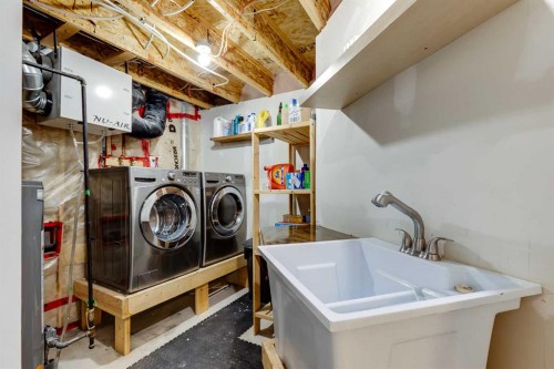 322 Tuscany Drive Nw, Calgary, AB - Indoor Photo Showing Laundry Room