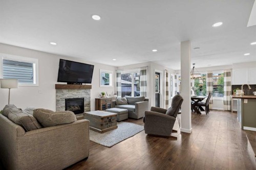 322 Tuscany Drive Nw, Calgary, AB - Indoor Photo Showing Living Room With Fireplace