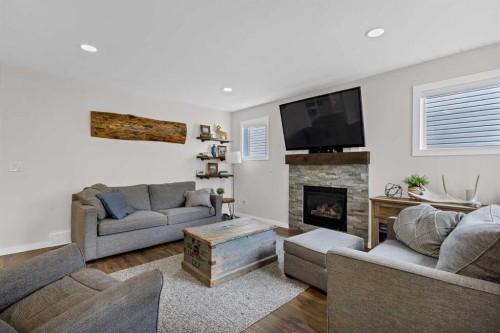 322 Tuscany Drive Nw, Calgary, AB - Indoor Photo Showing Living Room With Fireplace