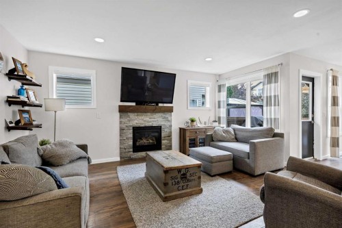 322 Tuscany Drive Nw, Calgary, AB - Indoor Photo Showing Living Room With Fireplace