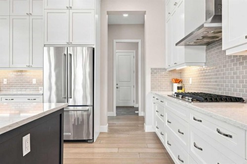 41 Whispering Springs Way, Heritage Pointe, AB - Indoor Photo Showing Kitchen With Upgraded Kitchen
