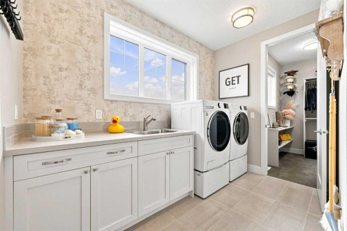 41 Whispering Springs Way, Heritage Pointe, AB - Indoor Photo Showing Laundry Room