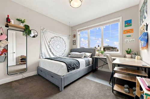 41 Whispering Springs Way, Heritage Pointe, AB - Indoor Photo Showing Bedroom