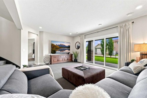 41 Whispering Springs Way, Heritage Pointe, AB - Indoor Photo Showing Living Room