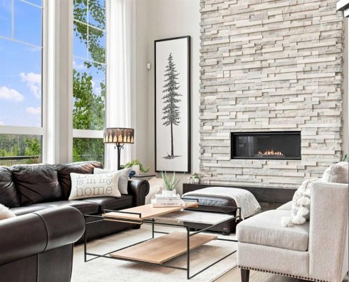 41 Whispering Springs Way, Heritage Pointe, AB - Indoor Photo Showing Living Room With Fireplace