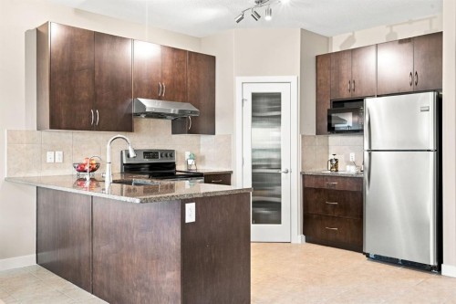 58 Everwoods Park Sw, Calgary, AB - Indoor Photo Showing Kitchen With Stainless Steel Kitchen With Upgraded Kitchen