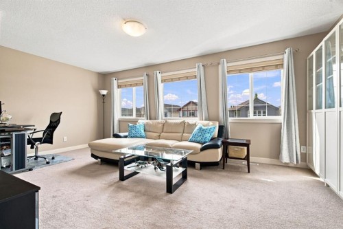 58 Everwoods Park Sw, Calgary, AB - Indoor Photo Showing Living Room