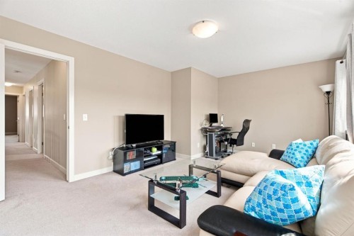 58 Everwoods Park Sw, Calgary, AB - Indoor Photo Showing Living Room