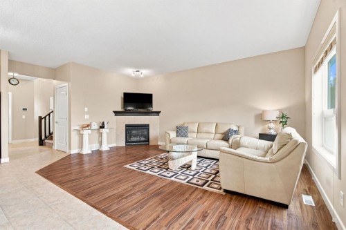 58 Everwoods Park Sw, Calgary, AB - Indoor Photo Showing Living Room With Fireplace