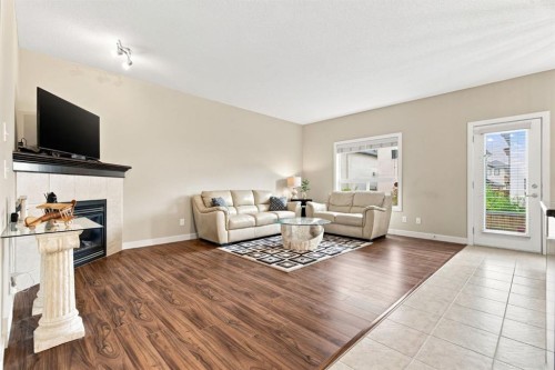 58 Everwoods Park Sw, Calgary, AB - Indoor Photo Showing Living Room With Fireplace