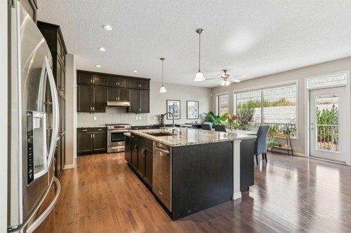7520 Springbank Way Sw, Calgary, AB - Indoor Photo Showing Kitchen With Stainless Steel Kitchen With Upgraded Kitchen