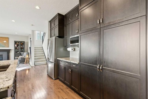 7520 Springbank Way Sw, Calgary, AB - Indoor Photo Showing Kitchen With Stainless Steel Kitchen With Upgraded Kitchen