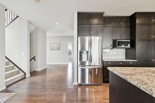 7520 Springbank Way Sw, Calgary, AB - Indoor Photo Showing Kitchen With Stainless Steel Kitchen