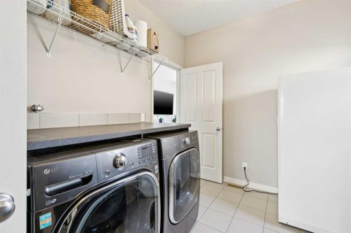 7520 Springbank Way Sw, Calgary, AB - Indoor Photo Showing Laundry Room