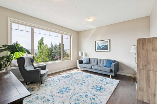7520 Springbank Way Sw, Calgary, AB - Indoor Photo Showing Living Room