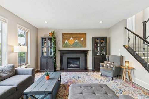 7520 Springbank Way Sw, Calgary, AB - Indoor Photo Showing Living Room With Fireplace