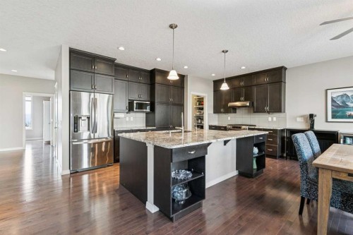 7520 Springbank Way Sw, Calgary, AB - Indoor Photo Showing Kitchen With Stainless Steel Kitchen With Upgraded Kitchen