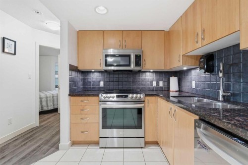 305-1078 6 Avenue Sw, Calgary, AB - Indoor Photo Showing Kitchen With Stainless Steel Kitchen With Double Sink