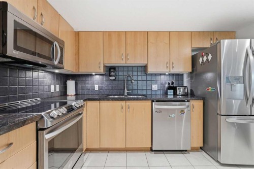 305-1078 6 Avenue Sw, Calgary, AB - Indoor Photo Showing Kitchen With Stainless Steel Kitchen