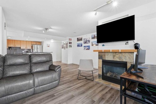 305-1078 6 Avenue Sw, Calgary, AB - Indoor Photo Showing Living Room With Fireplace