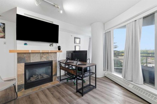 305-1078 6 Avenue Sw, Calgary, AB - Indoor Photo Showing Living Room With Fireplace