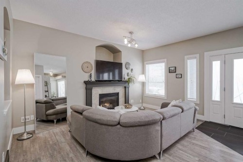 260 Chaparral Ridge Circle Se, Calgary, AB - Indoor Photo Showing Living Room With Fireplace