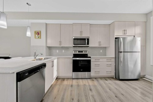 87 Legacy View Se, Calgary, AB - Indoor Photo Showing Kitchen With Double Sink