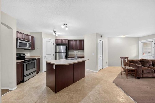 #104-20 Panatella Landing Nw, Calgary, AB - Indoor Photo Showing Kitchen With Stainless Steel Kitchen
