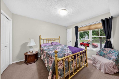 #104-20 Panatella Landing Nw, Calgary, AB - Indoor Photo Showing Bedroom